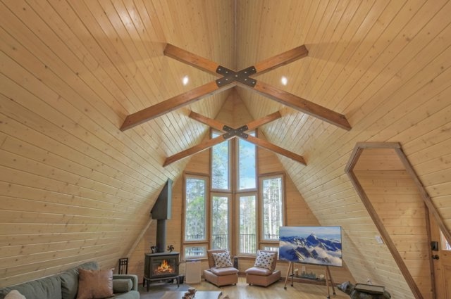 Soaring vaulted wood-beam ceiling inside The Evergreen Aerie's great room